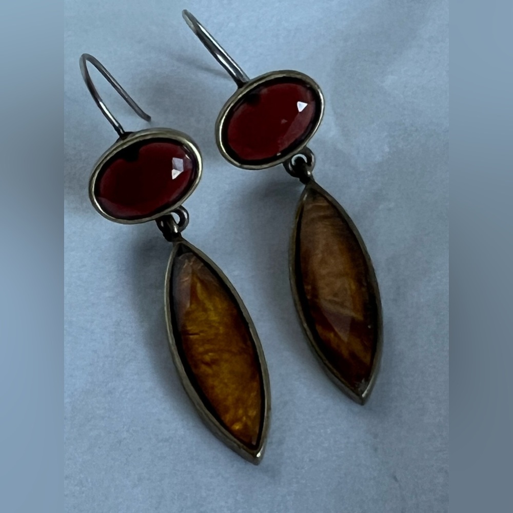 Earrings with brassy finish $16.